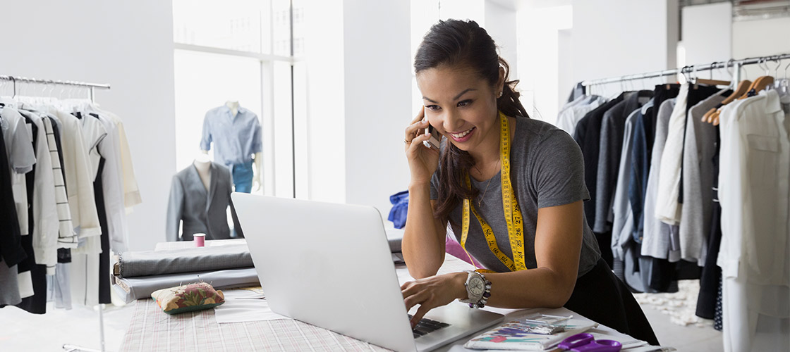 Small business owner on her laptop for online banking and electronic statements Small business owner on her laptop for online banking and electronic statements