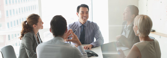 Business meeting with smiling team 