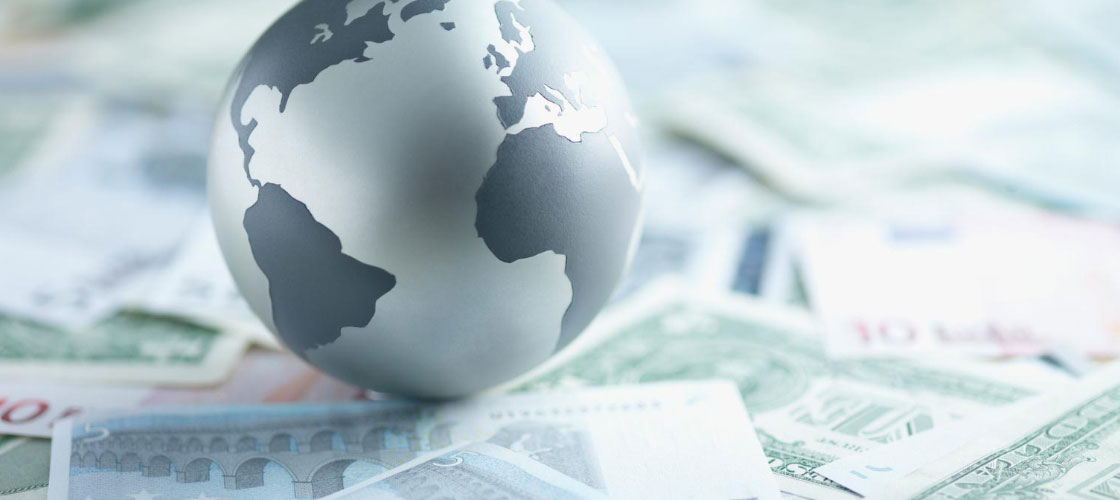 3d model of earth sitting on top of various money currencies