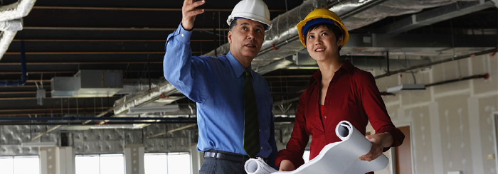 Commercial real estate banker and construction manager on commercial property site Commercial real estate banker and construction manager on commercial property site