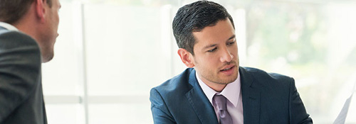 Financial consultant reviewing business planning document