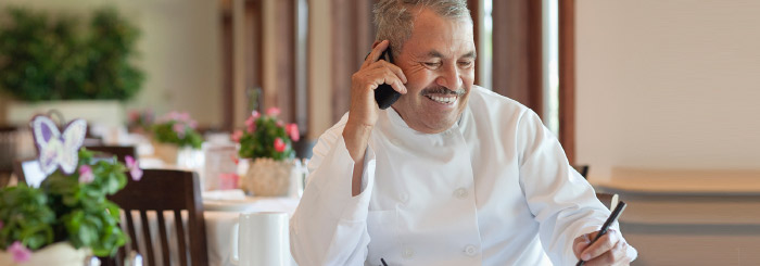 Business owner confidently smiling.