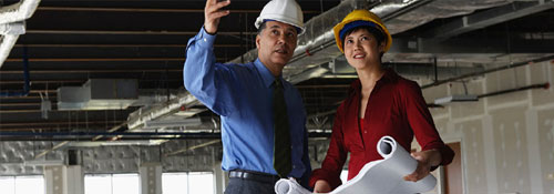 Commercial real estate banker and construction manager on commercial property site
